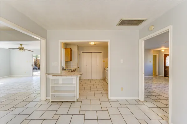 a view of a bathroom with sink and mirror