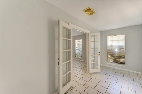 a bathroom with a shower and a sink