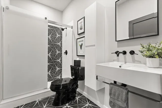 a outdoor space with lots of tables a garden view and living room