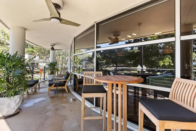 a view of a chairs and table in the balcony