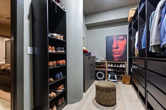 a bathroom with a toilet a sink and a mirror