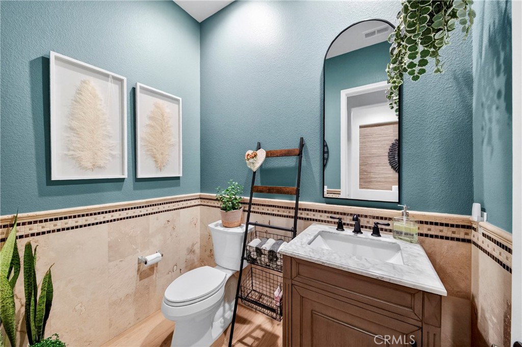 16375 Ory Circle Riverside, CA 92503 - Photo 34 of 51 a bathroom with a sink toilet and mirror
