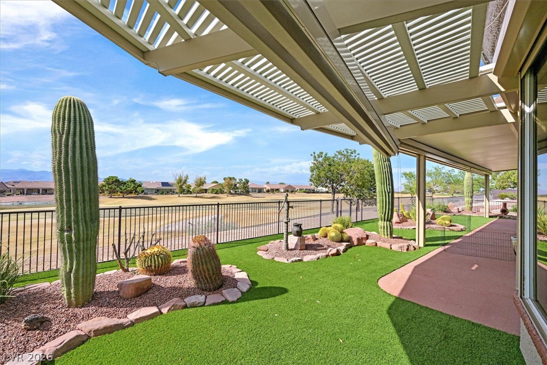 1823 Baton Rouge Street Henderson, NV 89052 - Photo 36 of 60 An inviting covered patio looks out over a landscaped yard bordering the local golf course.