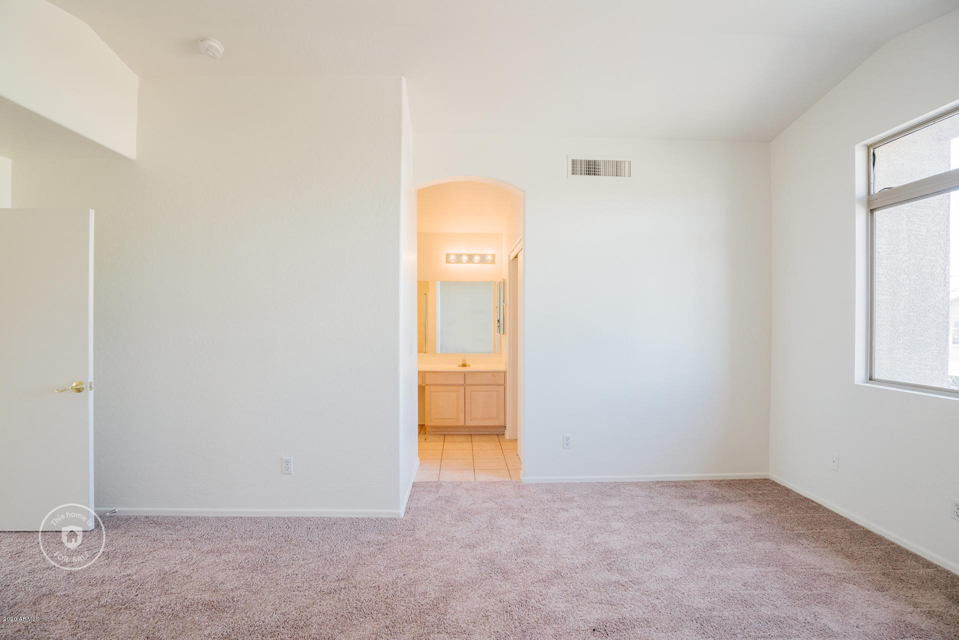 11245 West Almeria Road Avondale, AZ 85392 - Photo 15 of 23 an empty room with closet and mirror