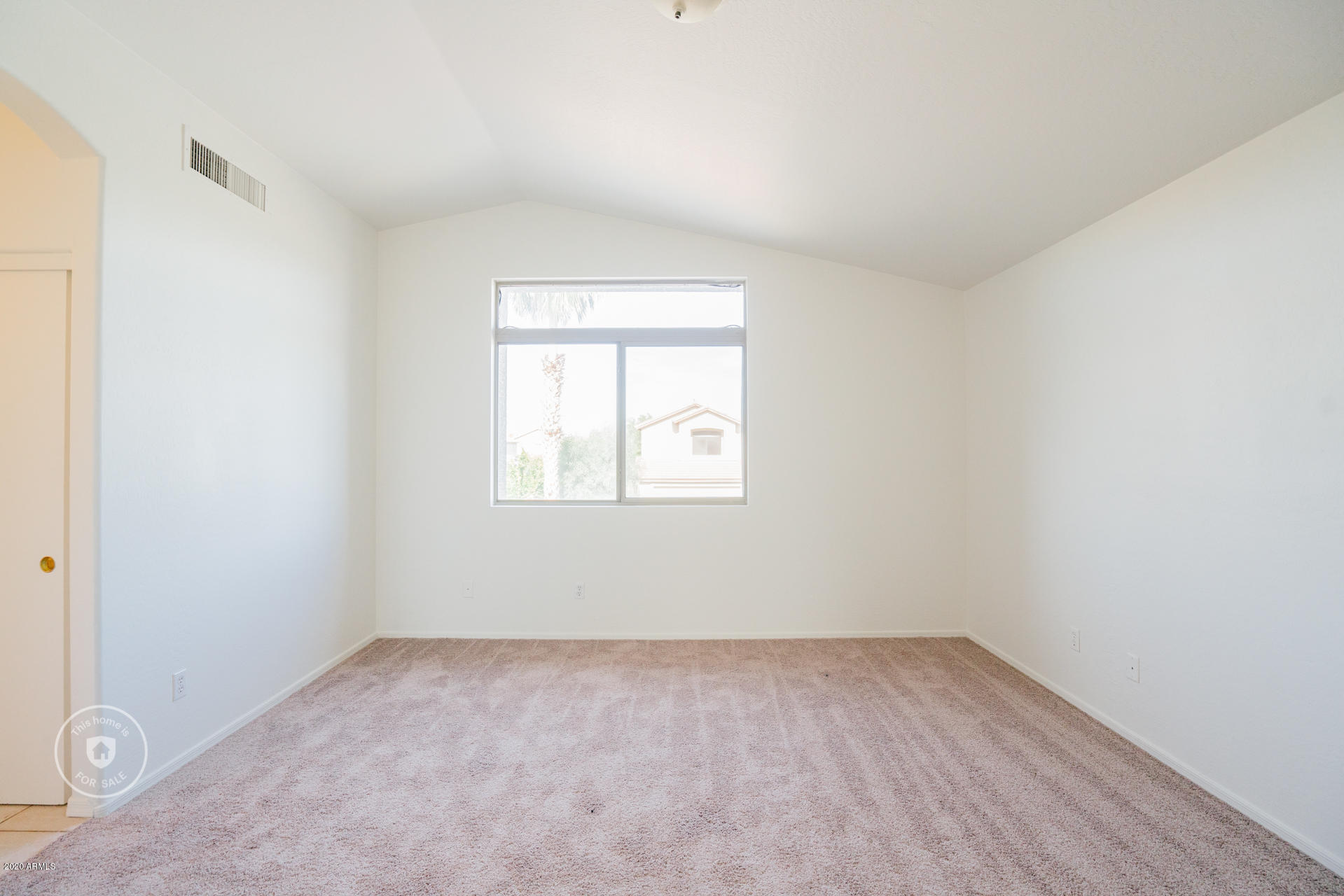 11245 West Almeria Road Avondale, AZ 85392 - Photo 5 of 23 an empty room with a window