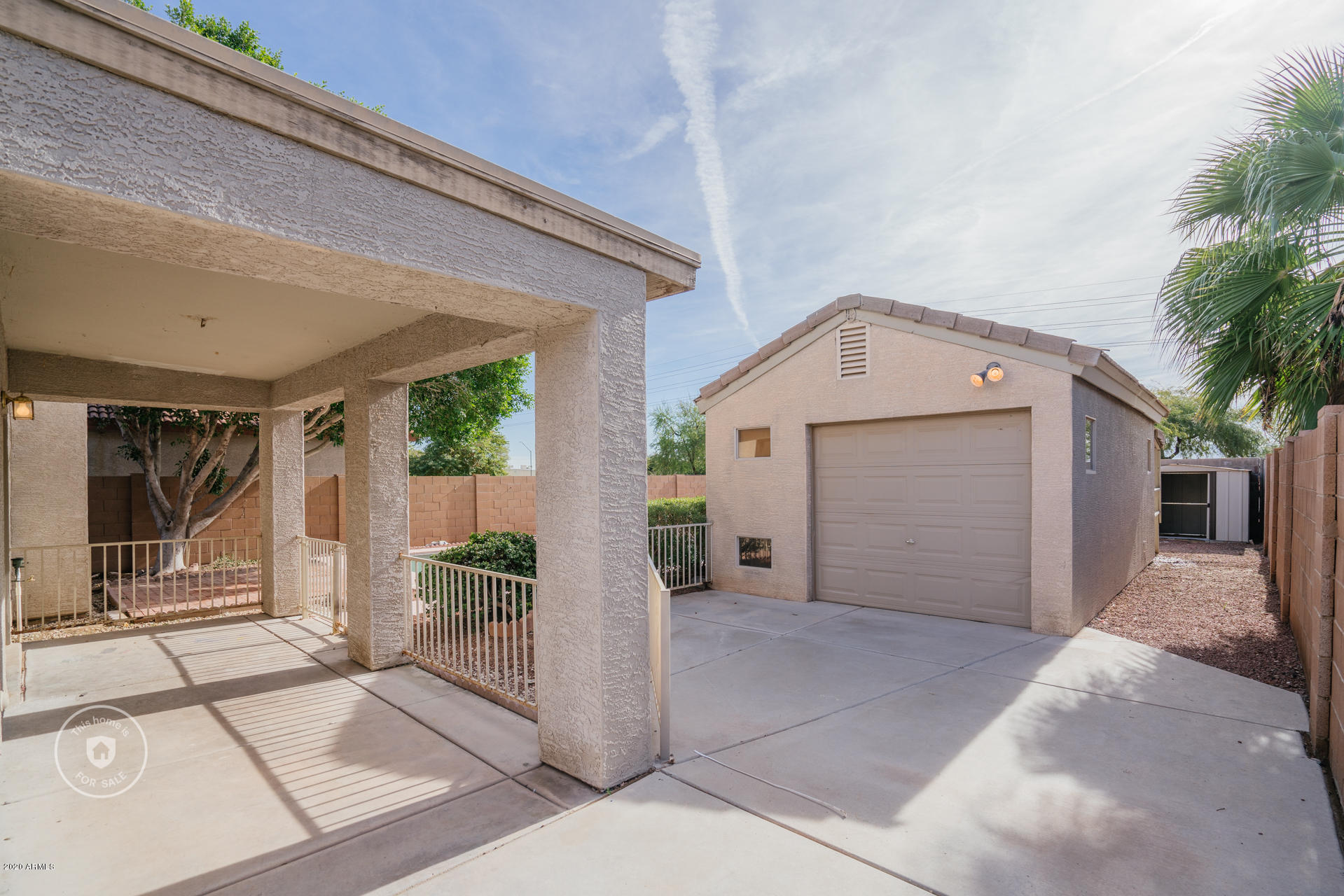 11245 West Almeria Road Avondale, AZ 85392 - Photo 7 of 23 a view of a house with porch