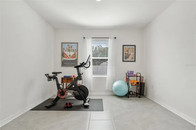 a room with furniture and gym equipment