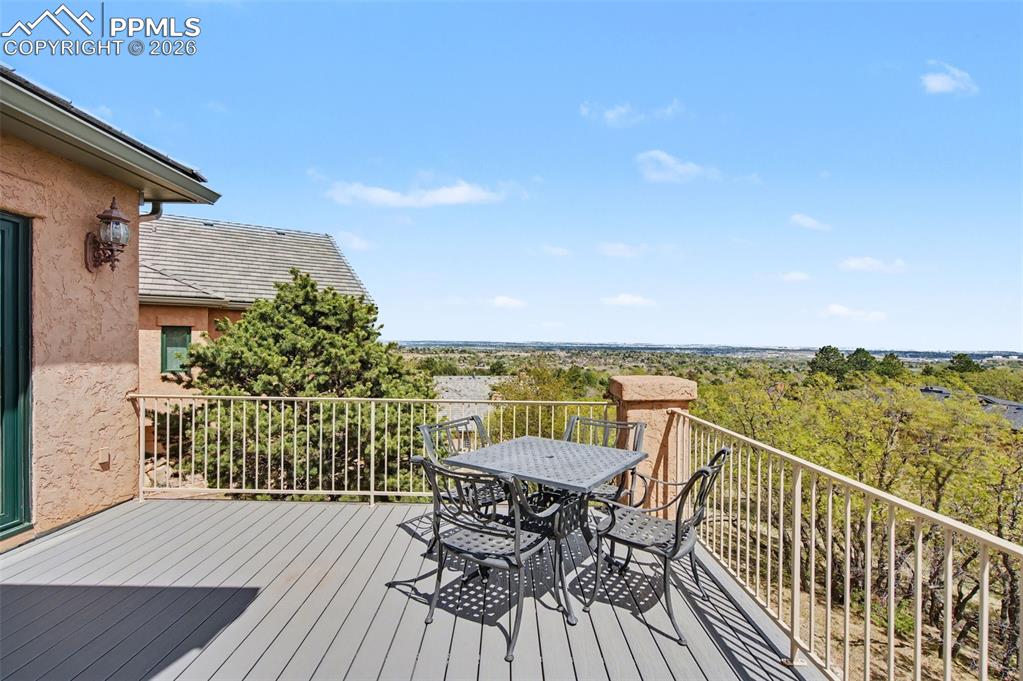 4215 Star Ranch Road Colorado Springs, CO 80906 - Photo 43 of 44 a view of a balcony with lake view and wooden floor