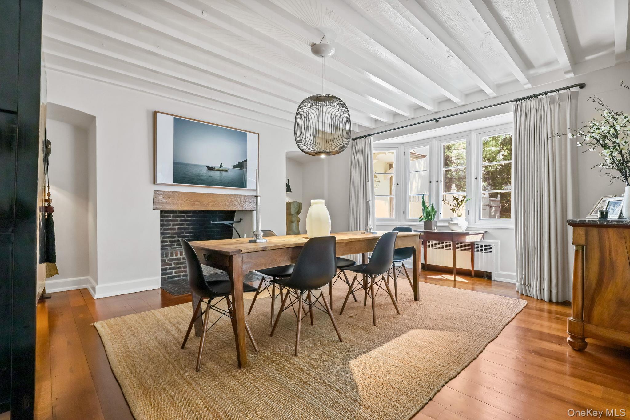 4 High Road Bronxville, NY 10708 - Photo 13 of 32 a view of a dining room with furniture window and wooden floor