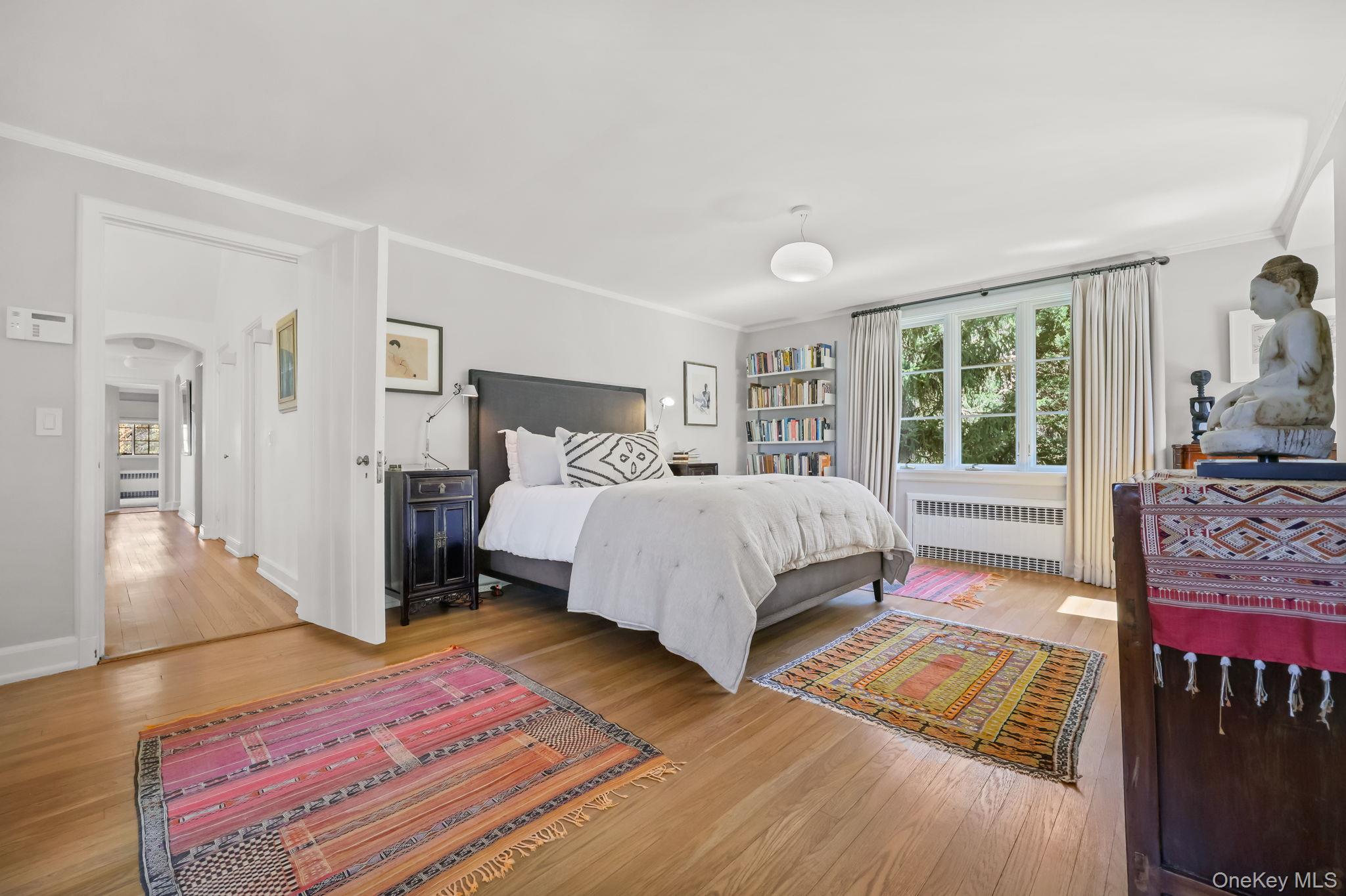 4 High Road Bronxville, NY 10708 - Photo 20 of 32 a bedroom with a bed wooden floor and window