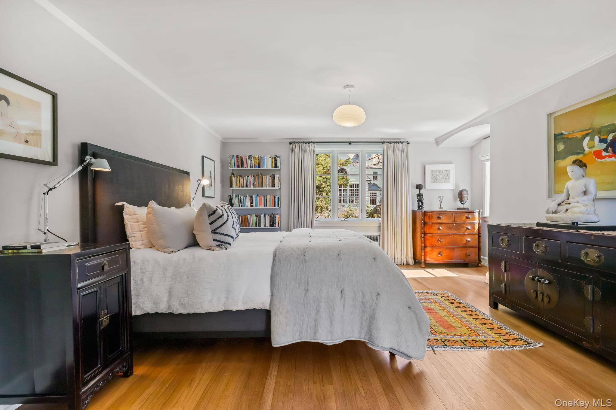 4 High Road Bronxville, NY 10708 - Photo 21 of 32 a spacious bedroom with a bed and a dresser