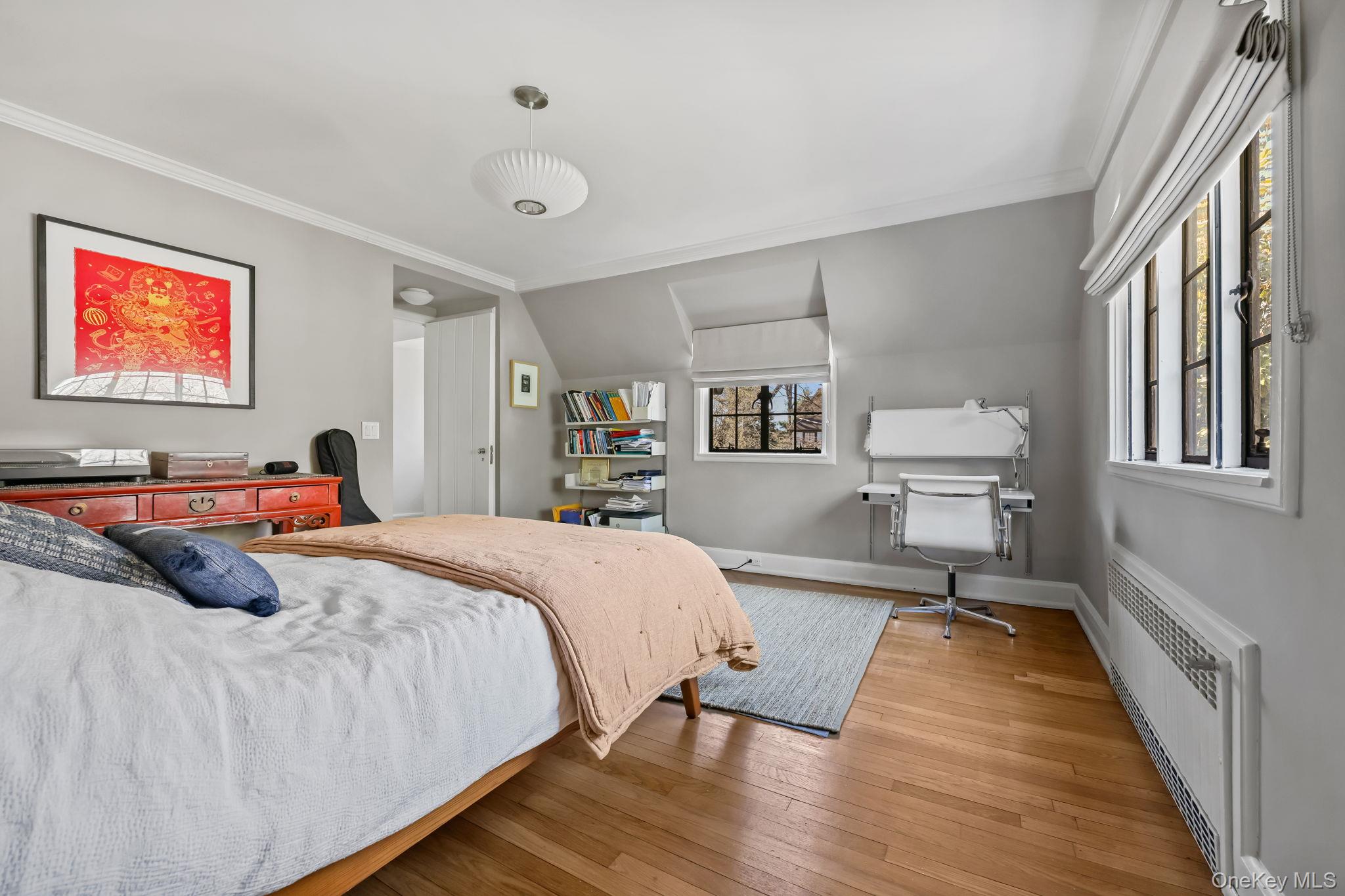 4 High Road Bronxville, NY 10708 - Photo 23 of 32 a bedroom with double bed and a large window