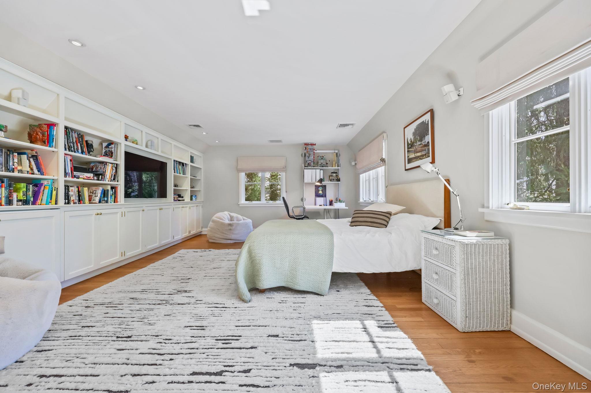 4 High Road Bronxville, NY 10708 - Photo 26 of 32 a living room with furniture and a flat screen tv