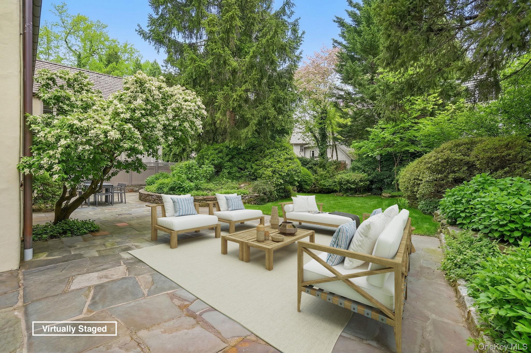 4 High Road Bronxville, NY 10708 - Photo 31 of 32 a view of backyard of house with seating space