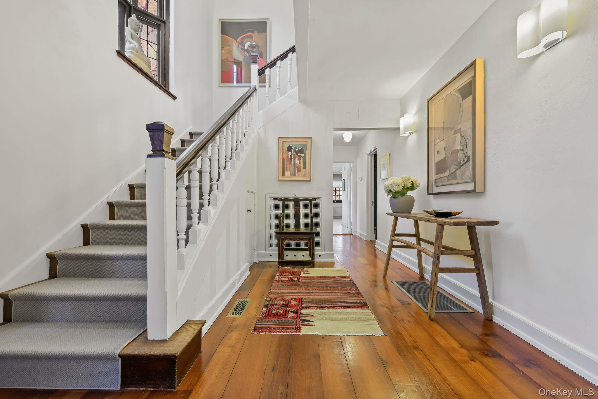 4 High Road Bronxville, NY 10708 - Photo 4 of 32 a view of entryway and hall with wooden floor