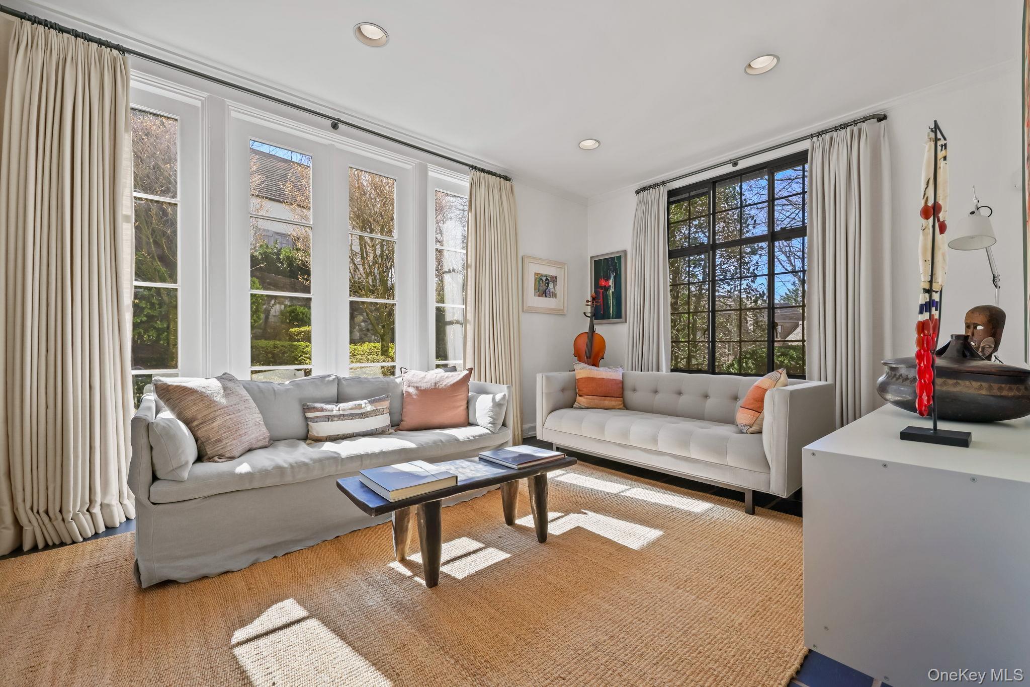 4 High Road Bronxville, NY 10708 - Photo 7 of 32 a living room with furniture and a large window