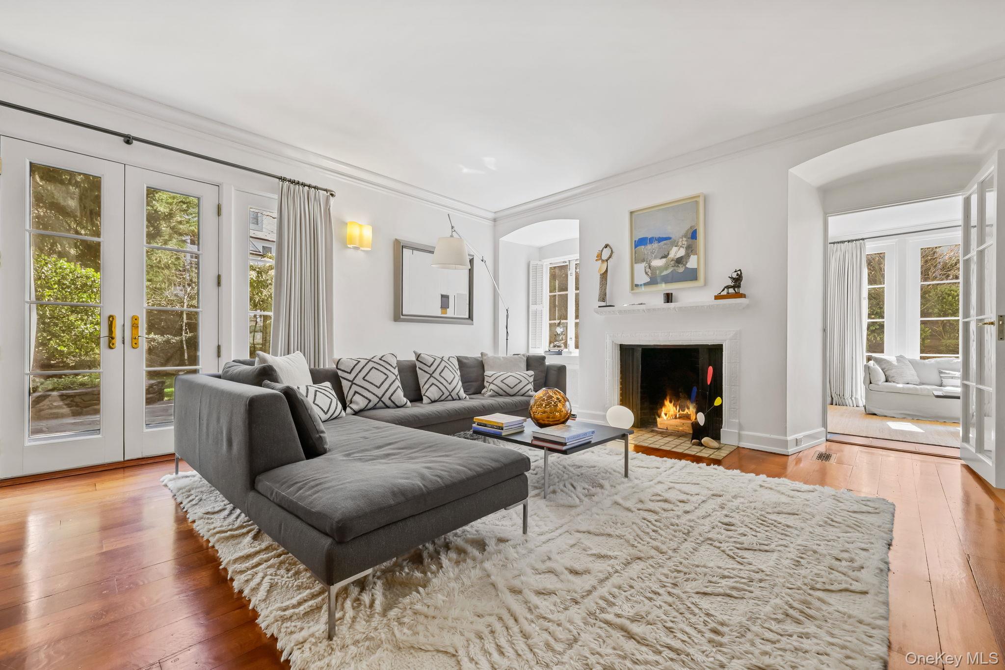 4 High Road Bronxville, NY 10708 - Photo 10 of 32 a living room with furniture and a fireplace