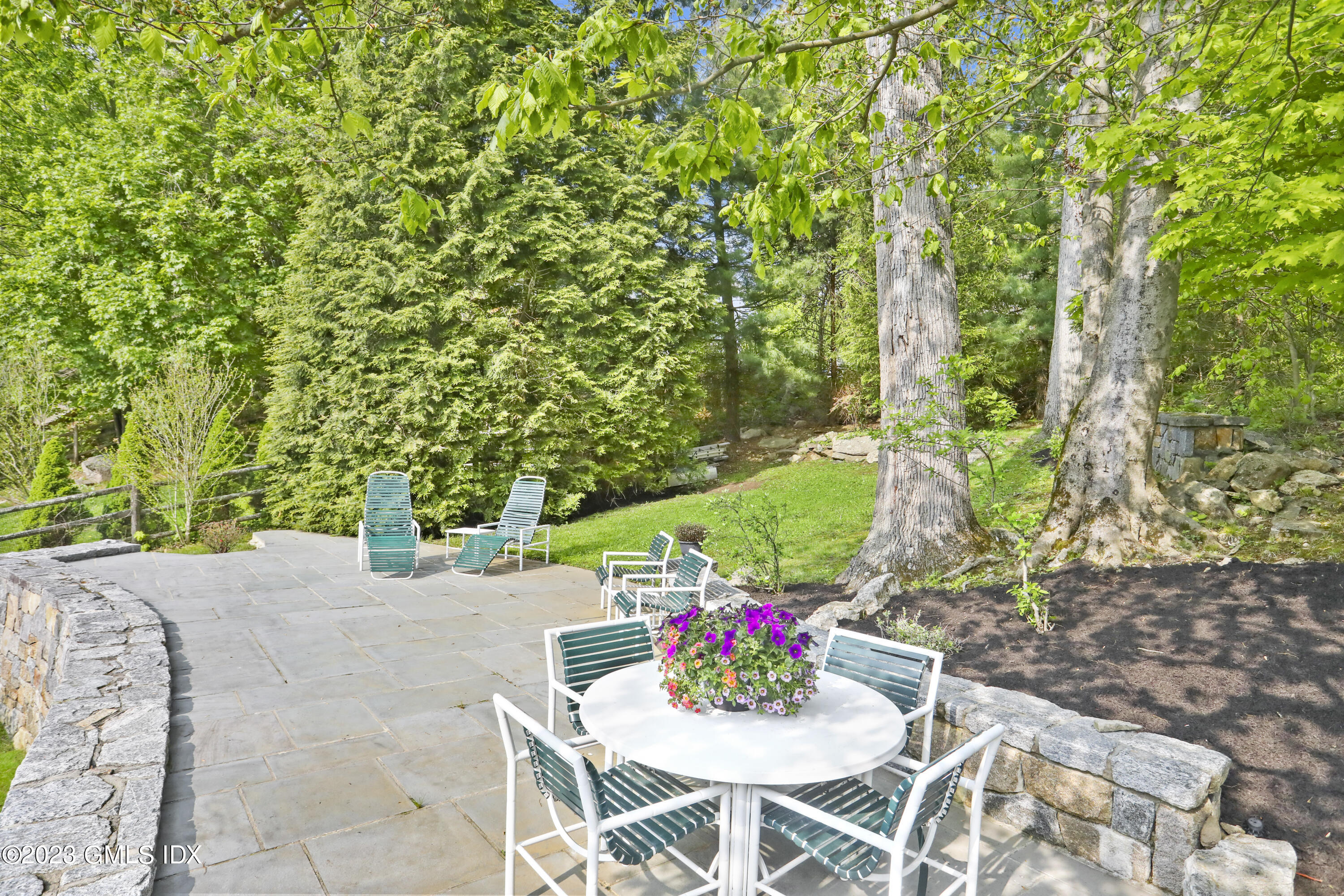 17 Fado Lane Cos Cob, CT 06807 - Photo 13 of 16 a patio with table and chairs and potted plants
