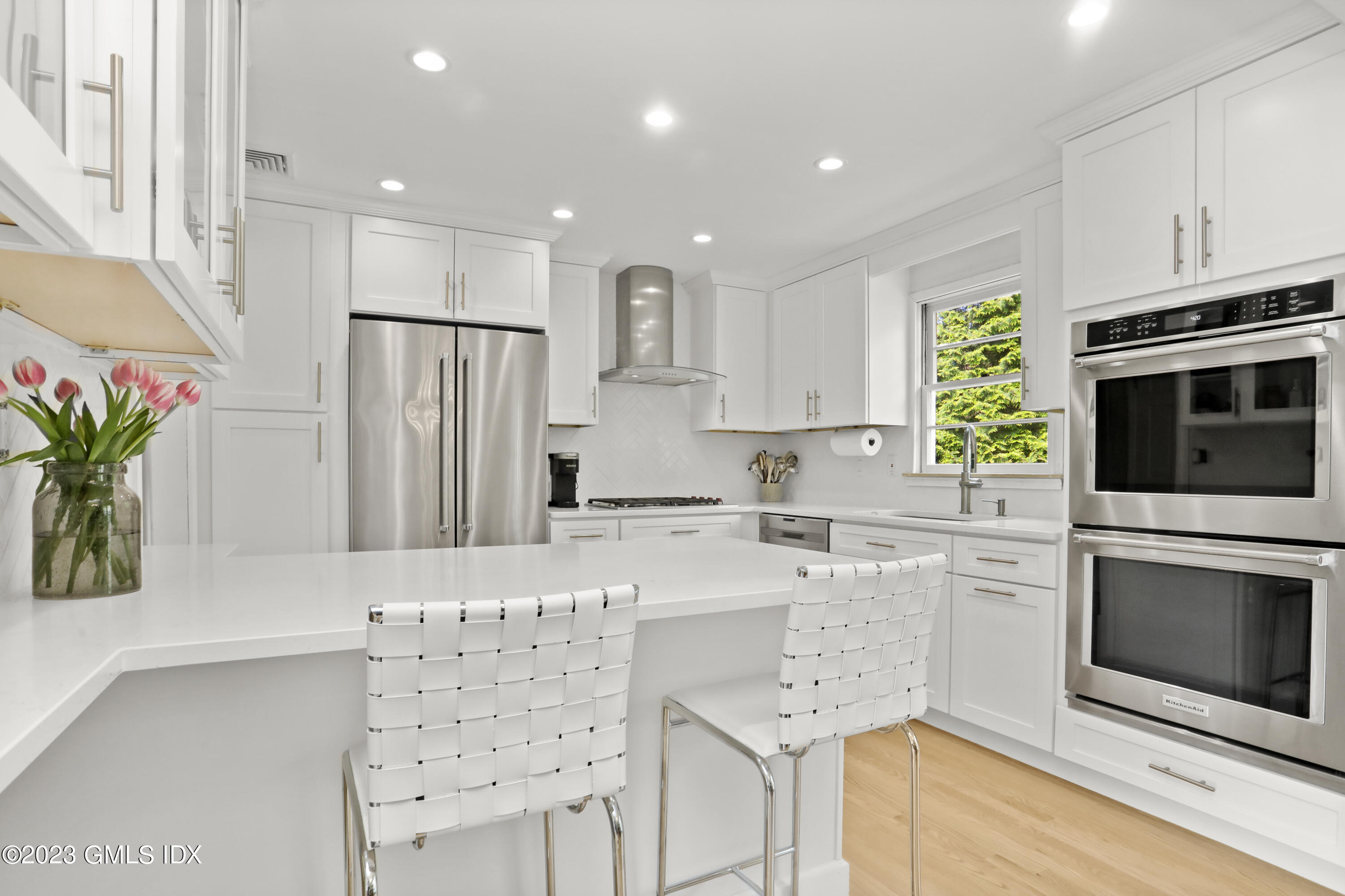 17 Fado Lane Cos Cob, CT 06807 - Photo 6 of 16 a kitchen with stainless steel appliances a refrigerator sink and microwave