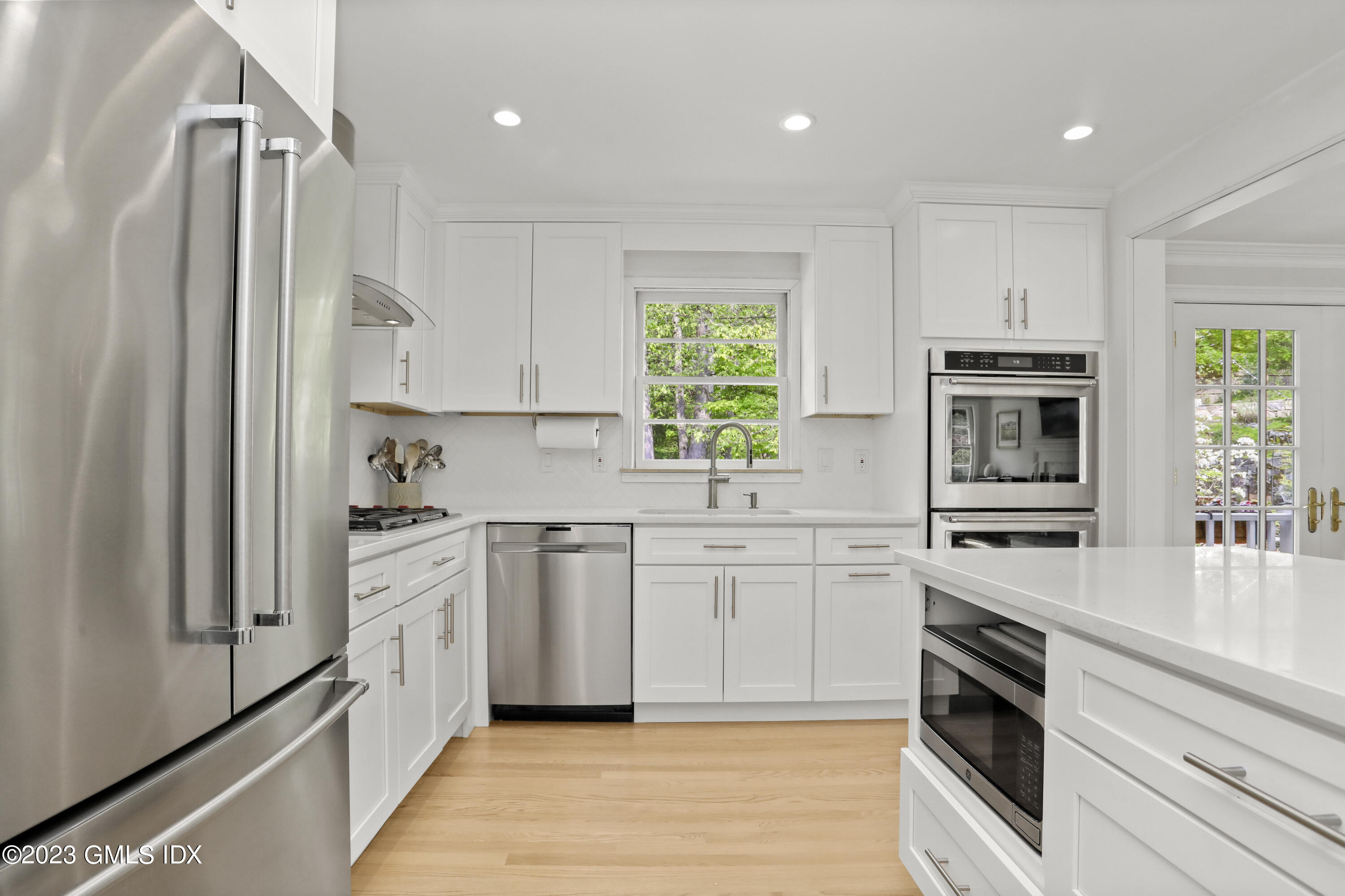 17 Fado Lane Cos Cob, CT 06807 - Photo 7 of 16 a kitchen with stainless steel appliances granite countertop a stove a sink and a refrigerator