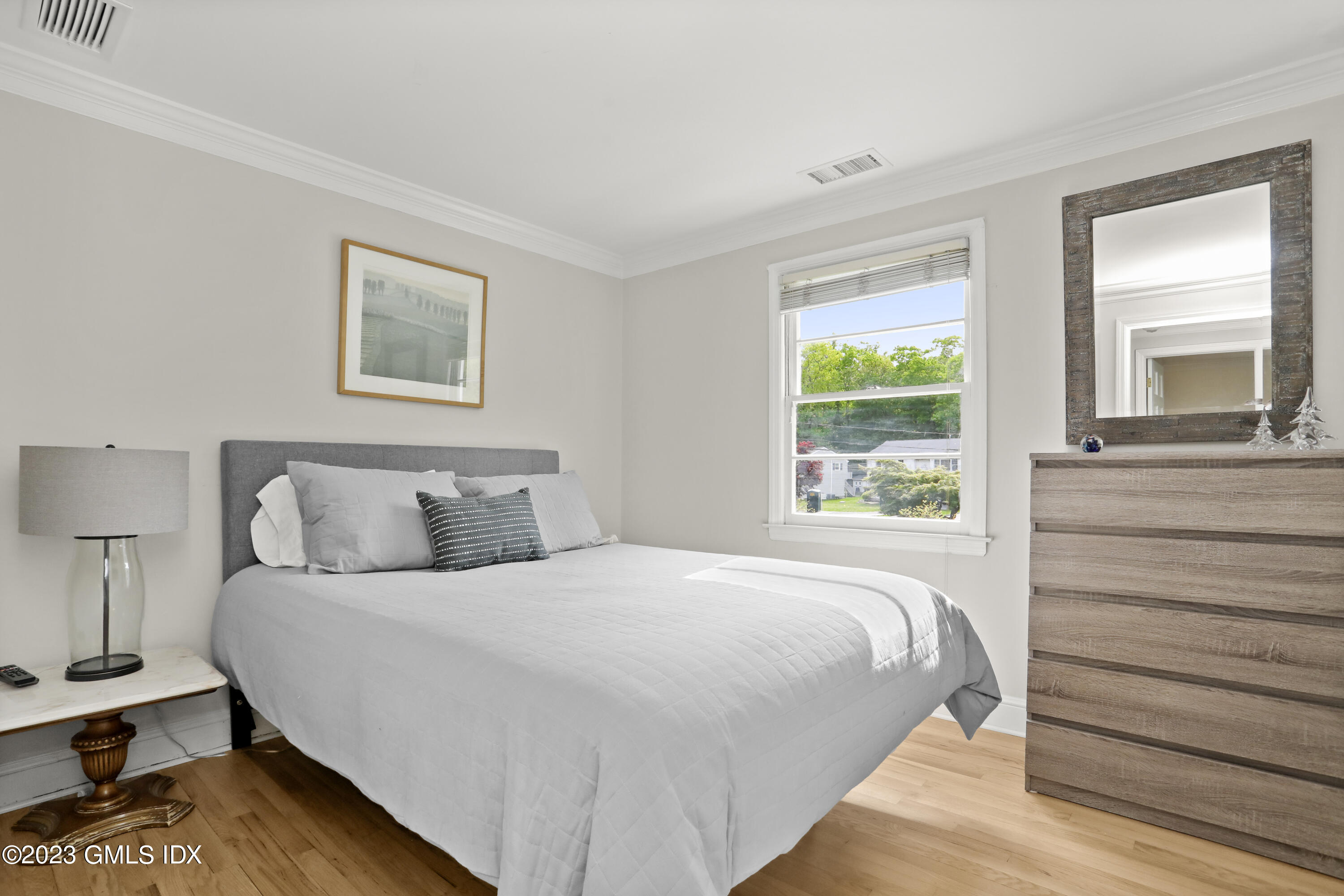 17 Fado Lane Cos Cob, CT 06807 - Photo 9 of 16 a bedroom with a bed and a window