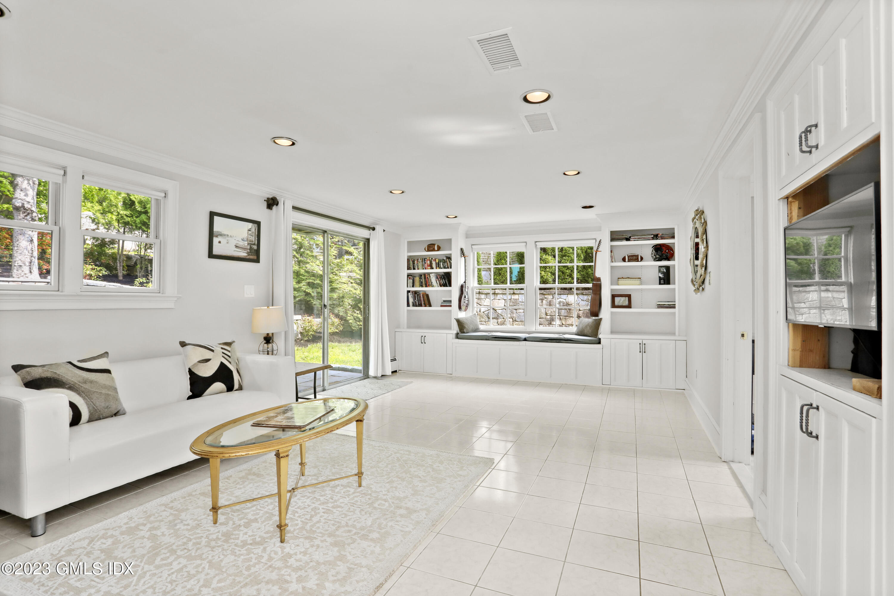 17 Fado Lane Cos Cob, CT 06807 - Photo 10 of 16 a living room with furniture and a flat screen tv