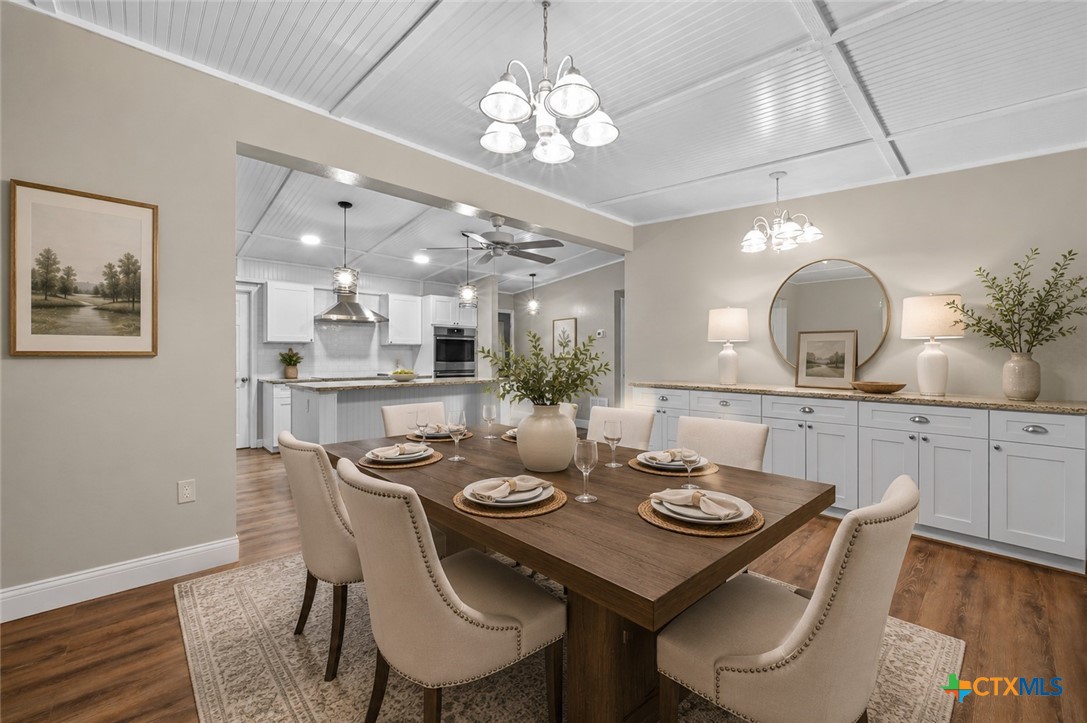 102 Rivercrest Street Luling, TX 78648 - Photo 3 of 36 a view of a dining room with furniture and wooden floor