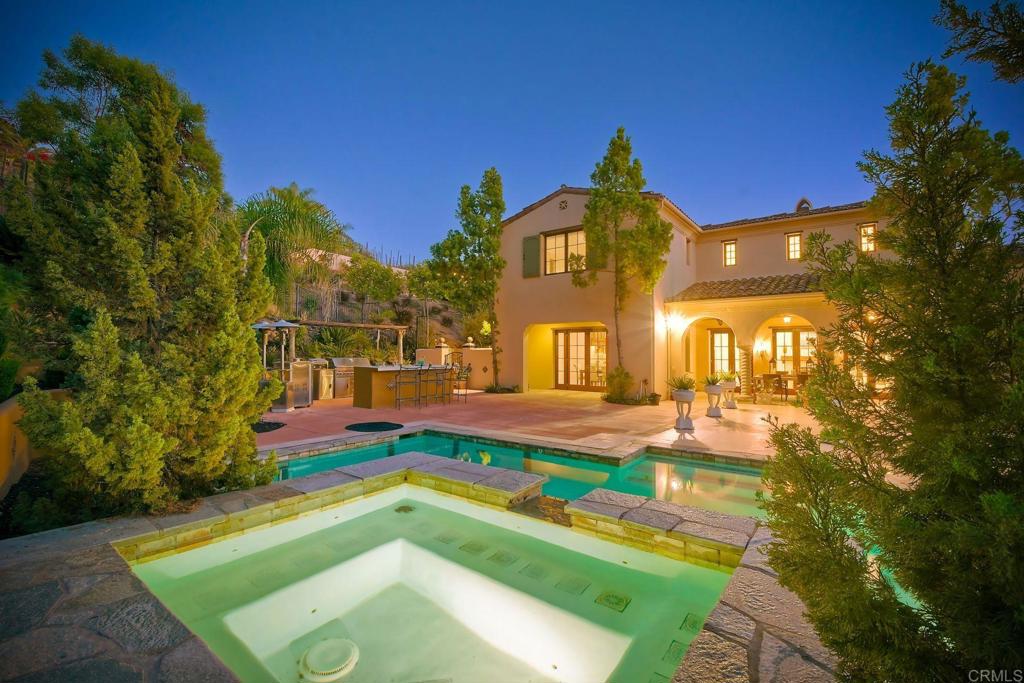 17284 Reflections Circle San Diego, CA 92127 - Photo 2 of 53 a swimming pool with tall trees