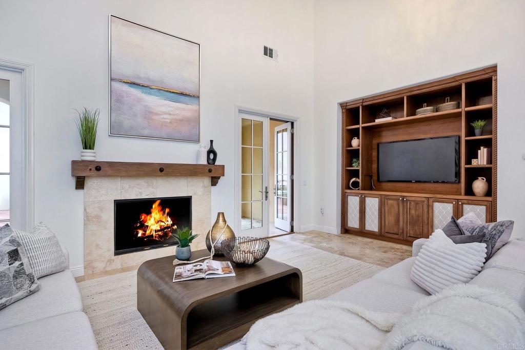 17284 Reflections Circle San Diego, CA 92127 - Photo 21 of 53 a living room with furniture and a fireplace