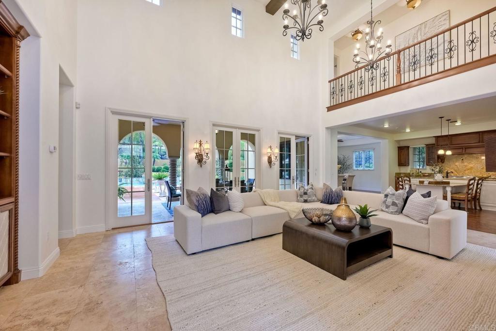 17284 Reflections Circle San Diego, CA 92127 - Photo 22 of 53 a living room with furniture and a chandelier