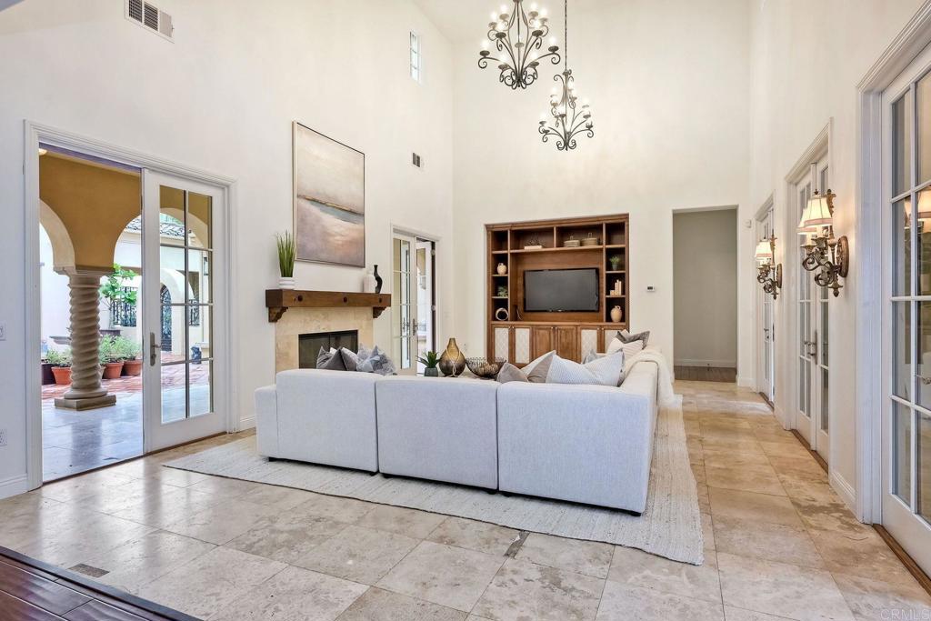 17284 Reflections Circle San Diego, CA 92127 - Photo 23 of 53 a living room with furniture fireplace and flat screen tv