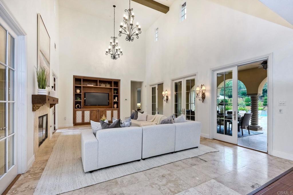 17284 Reflections Circle San Diego, CA 92127 - Photo 24 of 53 a living room with furniture and a flat screen tv