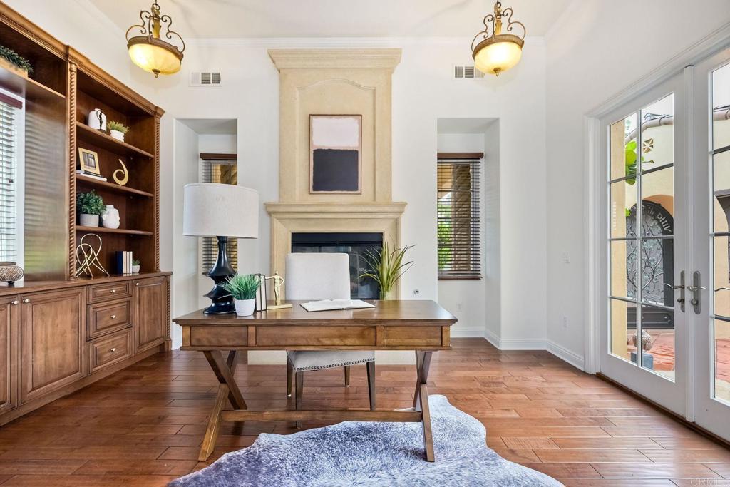 17284 Reflections Circle San Diego, CA 92127 - Photo 25 of 53 a living room with furniture and a fireplace