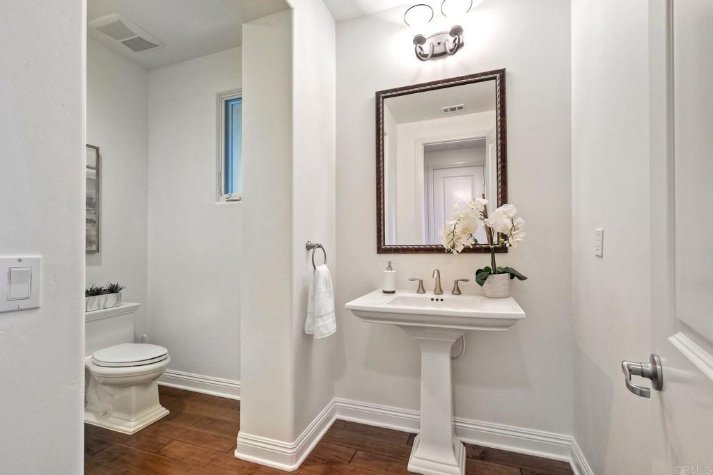 17284 Reflections Circle San Diego, CA 92127 - Photo 26 of 53 a bathroom with a toilet sink and mirror