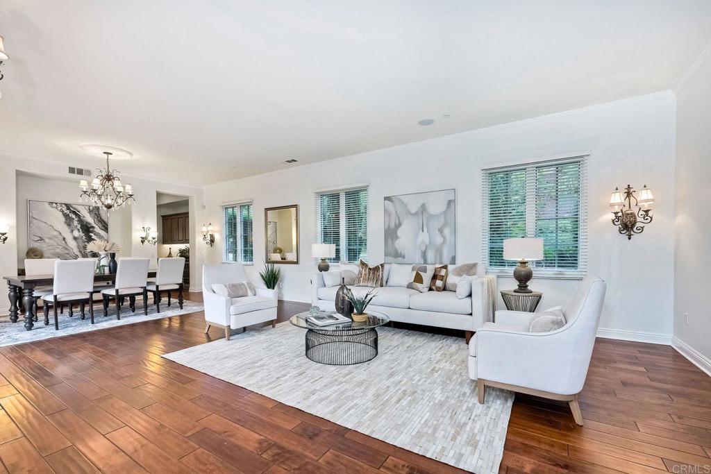 17284 Reflections Circle San Diego, CA 92127 - Photo 27 of 53 a living room with furniture and wooden floor