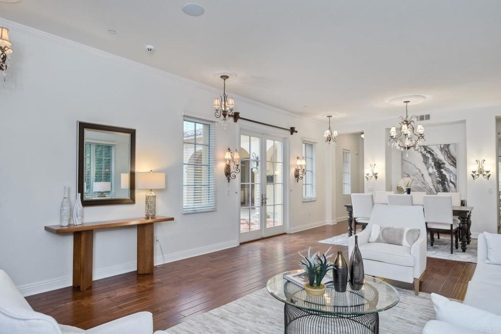 17284 Reflections Circle San Diego, CA 92127 - Photo 31 of 53 a living room with furniture and wooden floor