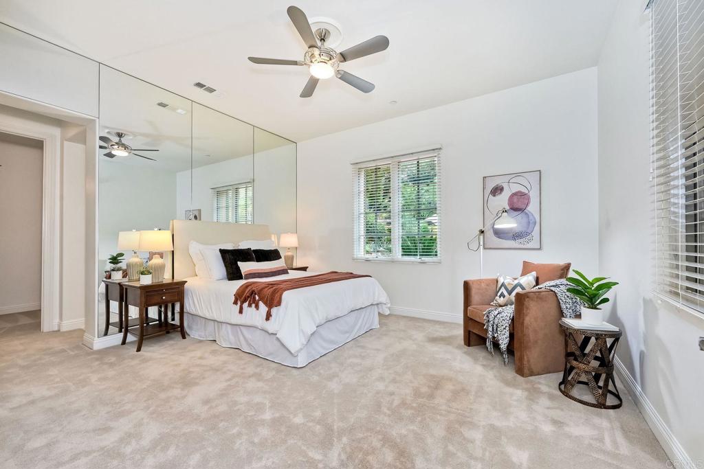 17284 Reflections Circle San Diego, CA 92127 - Photo 32 of 53 a bedroom with a bed and a chair