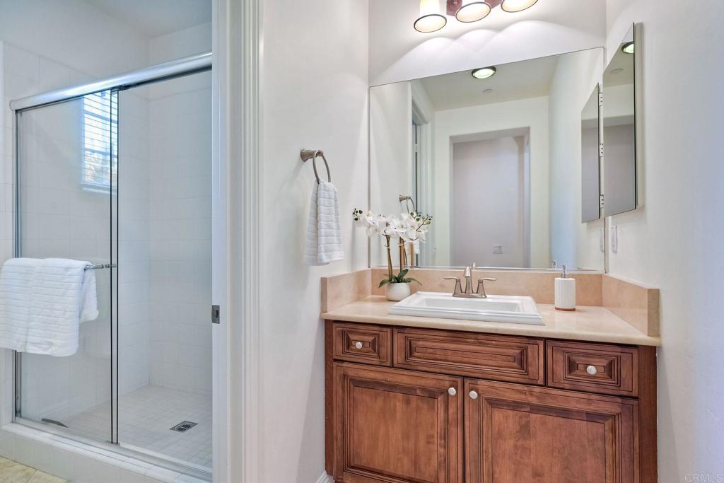 17284 Reflections Circle San Diego, CA 92127 - Photo 33 of 53 a bathroom with a sink vanity and mirror