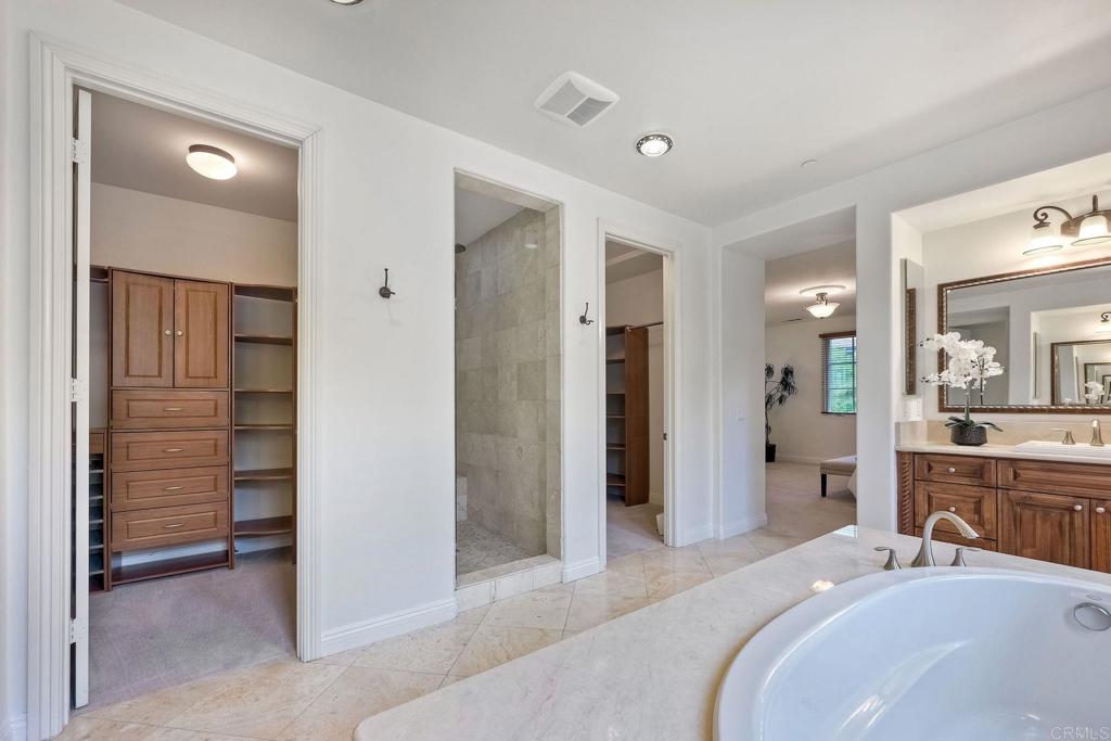 17284 Reflections Circle San Diego, CA 92127 - Photo 37 of 53 a bedroom with a bed and a bathroom