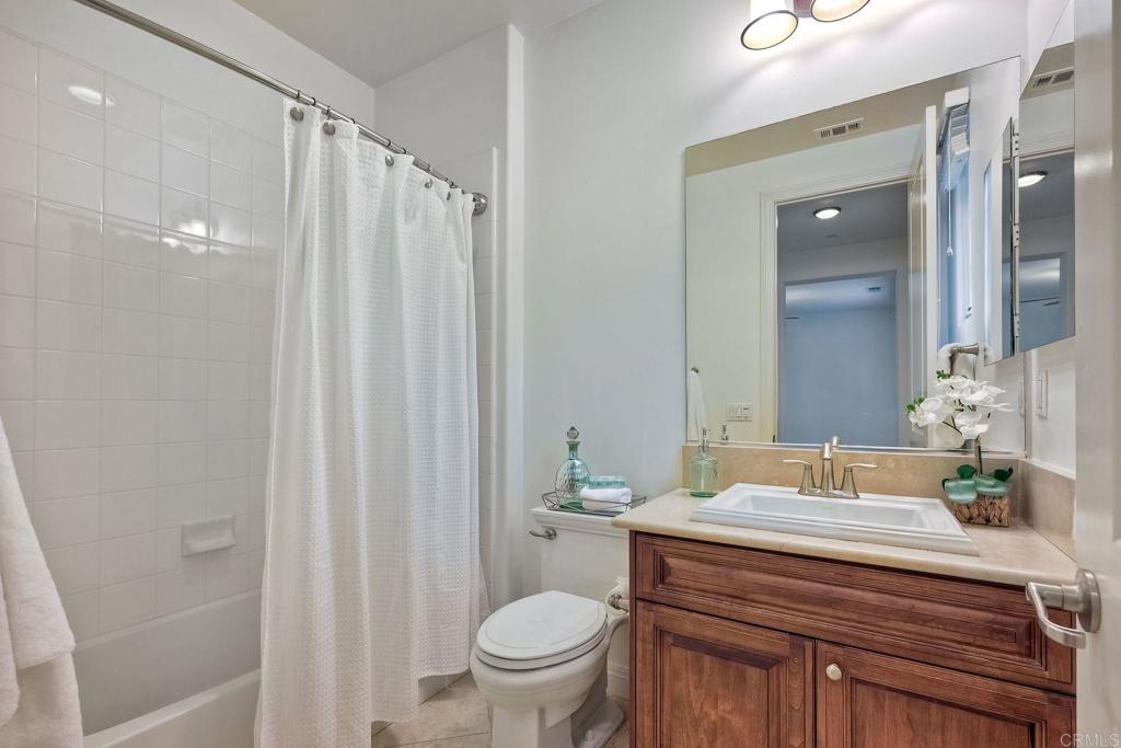 17284 Reflections Circle San Diego, CA 92127 - Photo 42 of 53 a bathroom with a granite countertop sink toilet and shower