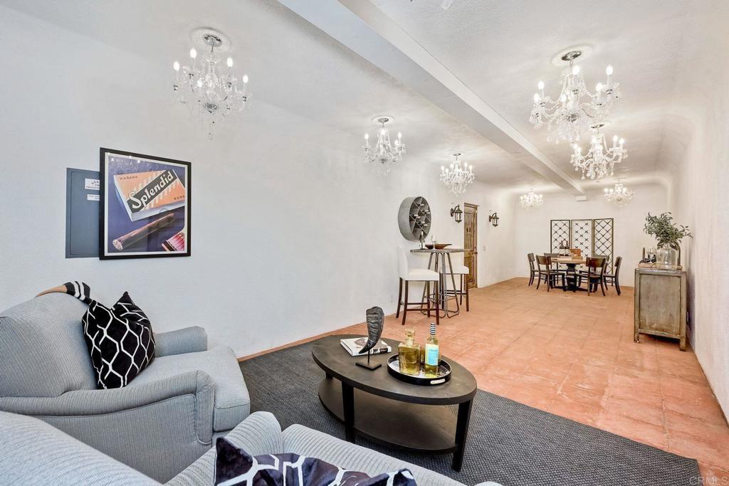 17284 Reflections Circle San Diego, CA 92127 - Photo 44 of 53 a living room with furniture and a chandelier