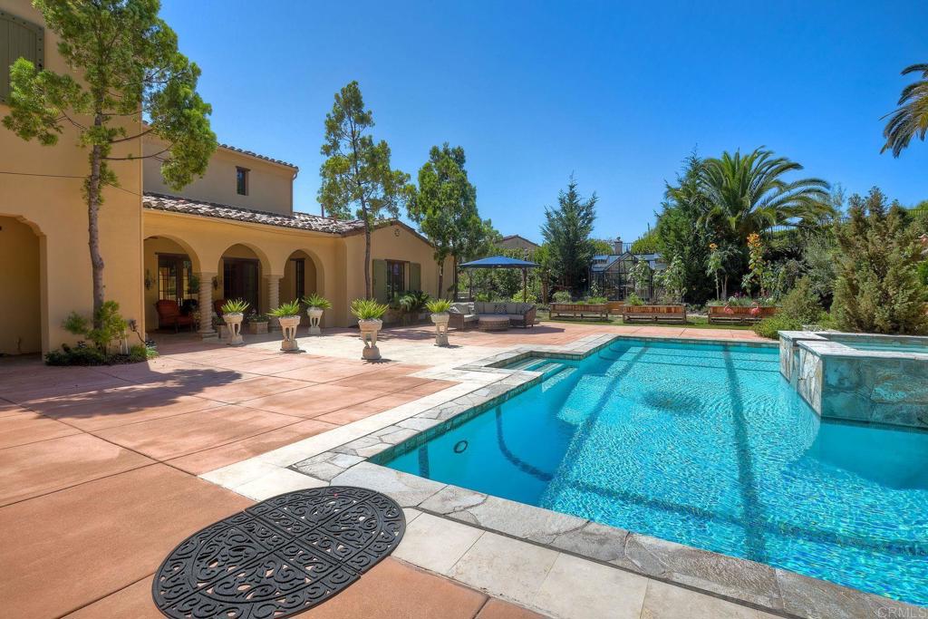 17284 Reflections Circle San Diego, CA 92127 - Photo 7 of 53 a swimming pool with outdoor seating and yard