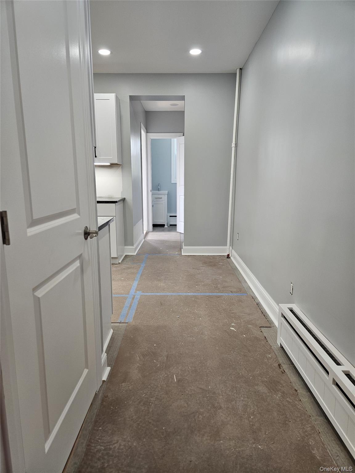 30-32 84th Street Queens, NY 11370 - Photo 11 of 37 an empty room with wooden floor