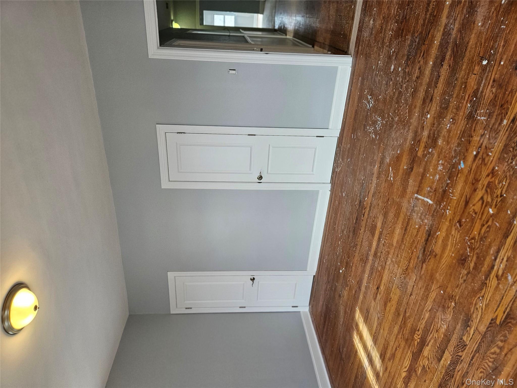 30-32 84th Street Queens, NY 11370 - Photo 21 of 37 a view of an empty room and wooden floor