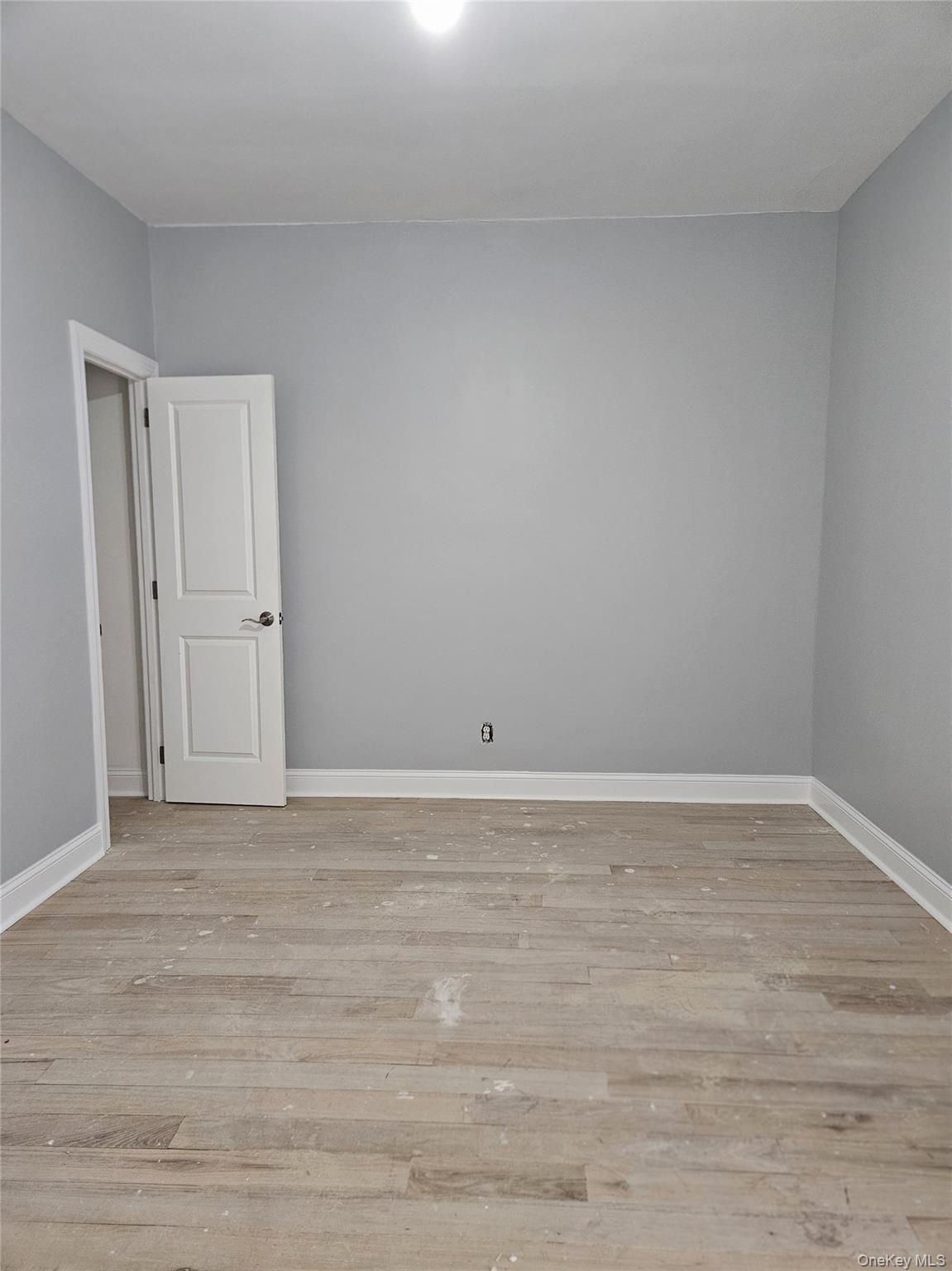 30-32 84th Street Queens, NY 11370 - Photo 24 of 37 a view of an empty room and wooden floor
