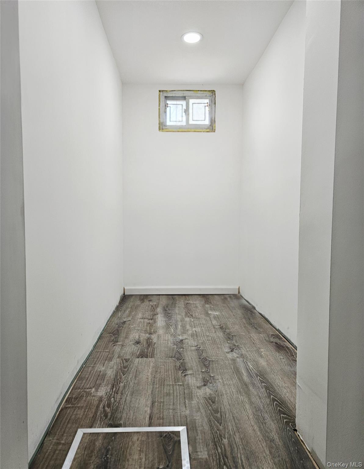 30-32 84th Street Queens, NY 11370 - Photo 32 of 37 an empty room with a bench