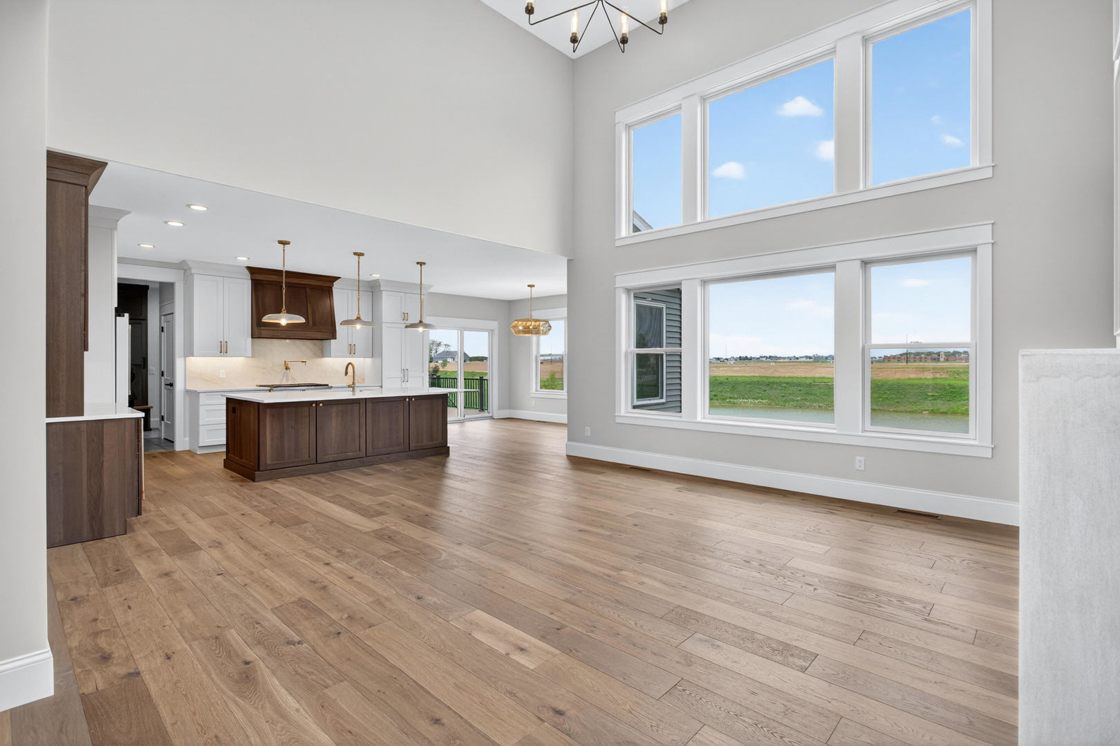6928 Wilderness Pointe Bettendorf, IA 52722 - Photo 9 of 48 a view of kitchen with kitchen island wooden floor and stainless steel appliances