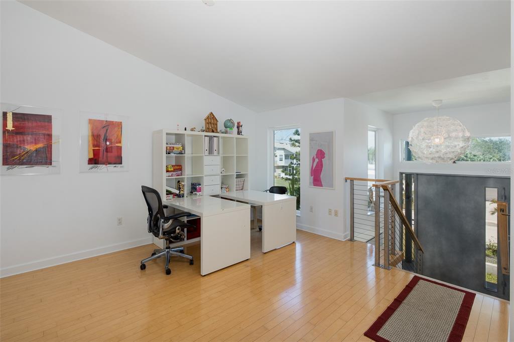 8401 Carolyn Drive Port Richey, FL 34668 - Photo 12 of 66 a view of a workspace with furniture and a livingroom