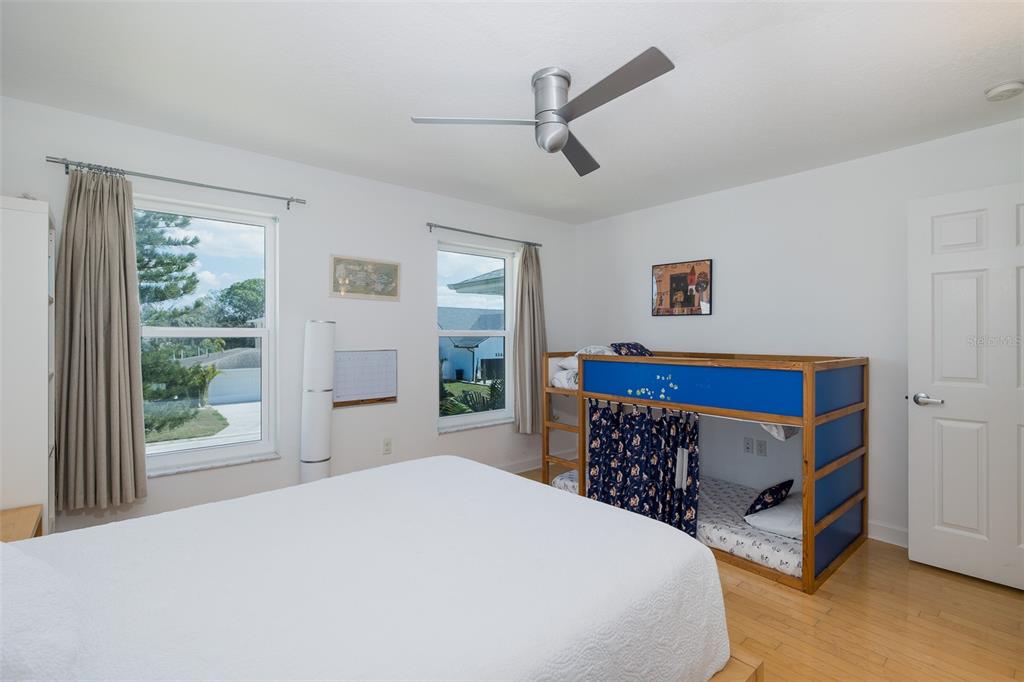 8401 Carolyn Drive Port Richey, FL 34668 - Photo 22 of 66 a bedroom with a bed and a window