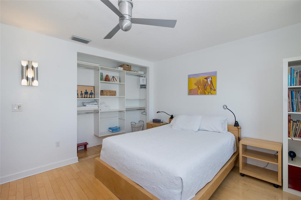 8401 Carolyn Drive Port Richey, FL 34668 - Photo 23 of 66 a bedroom with a bed and painting on the wall